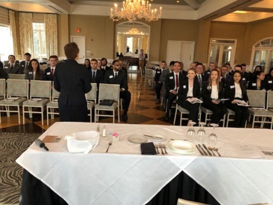 Students receiving etiquette training at The Farm Gold and Country Club