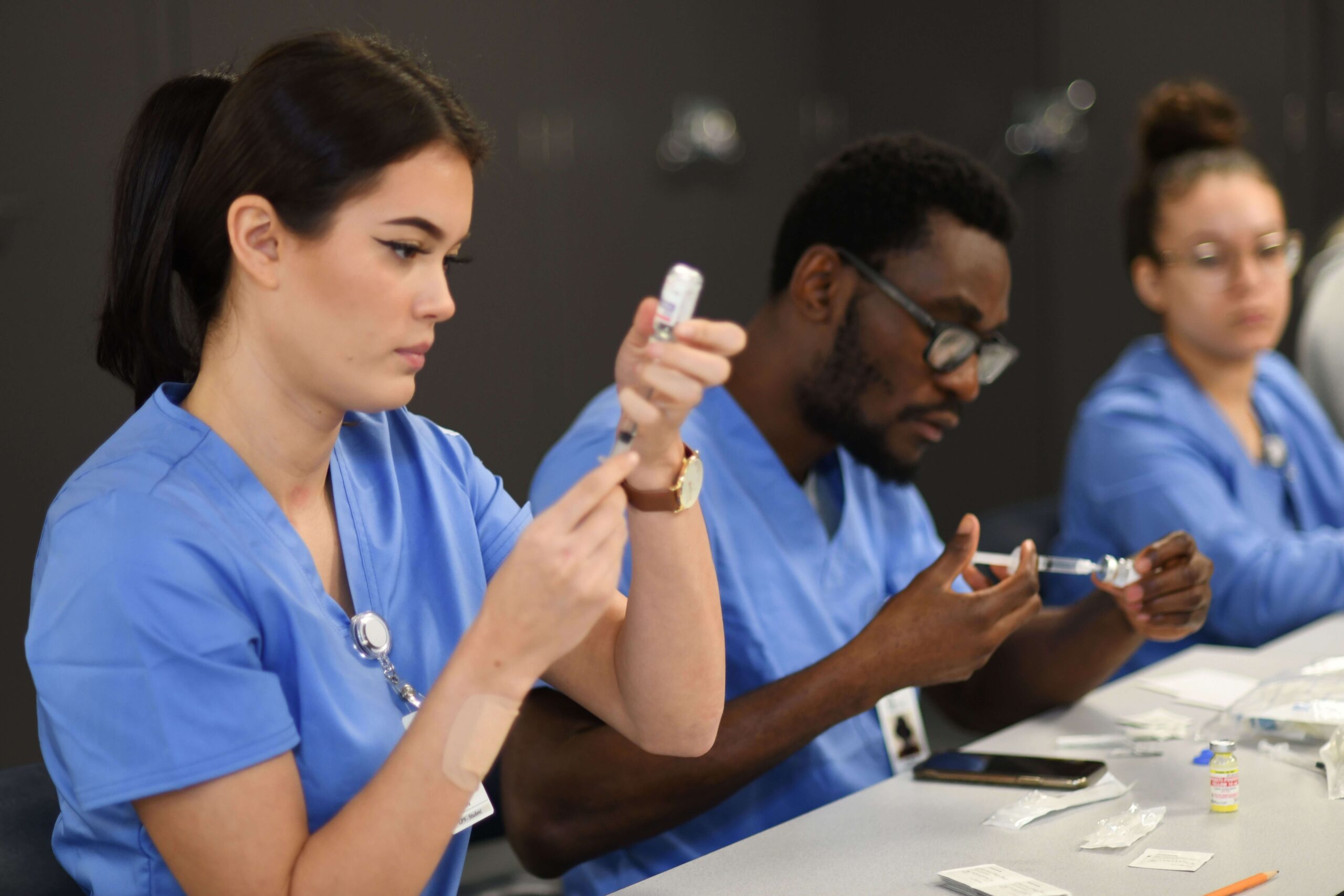 Students drawing a shot