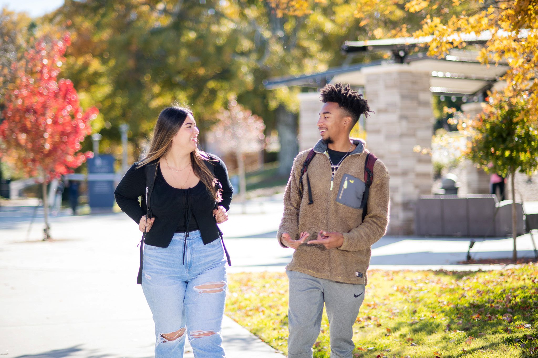 Students with backpacks talking outdoors