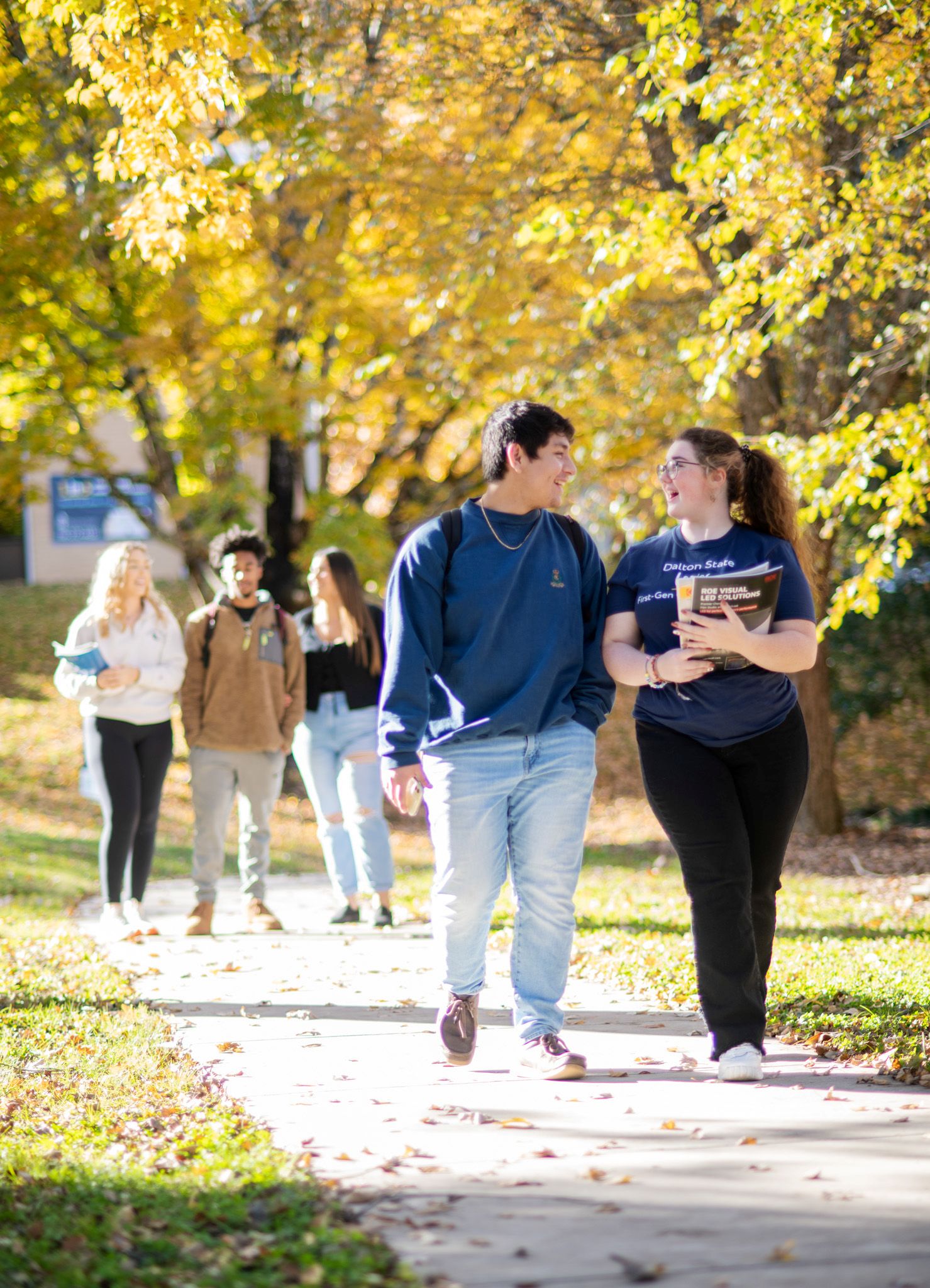 students walking on campus during fall
