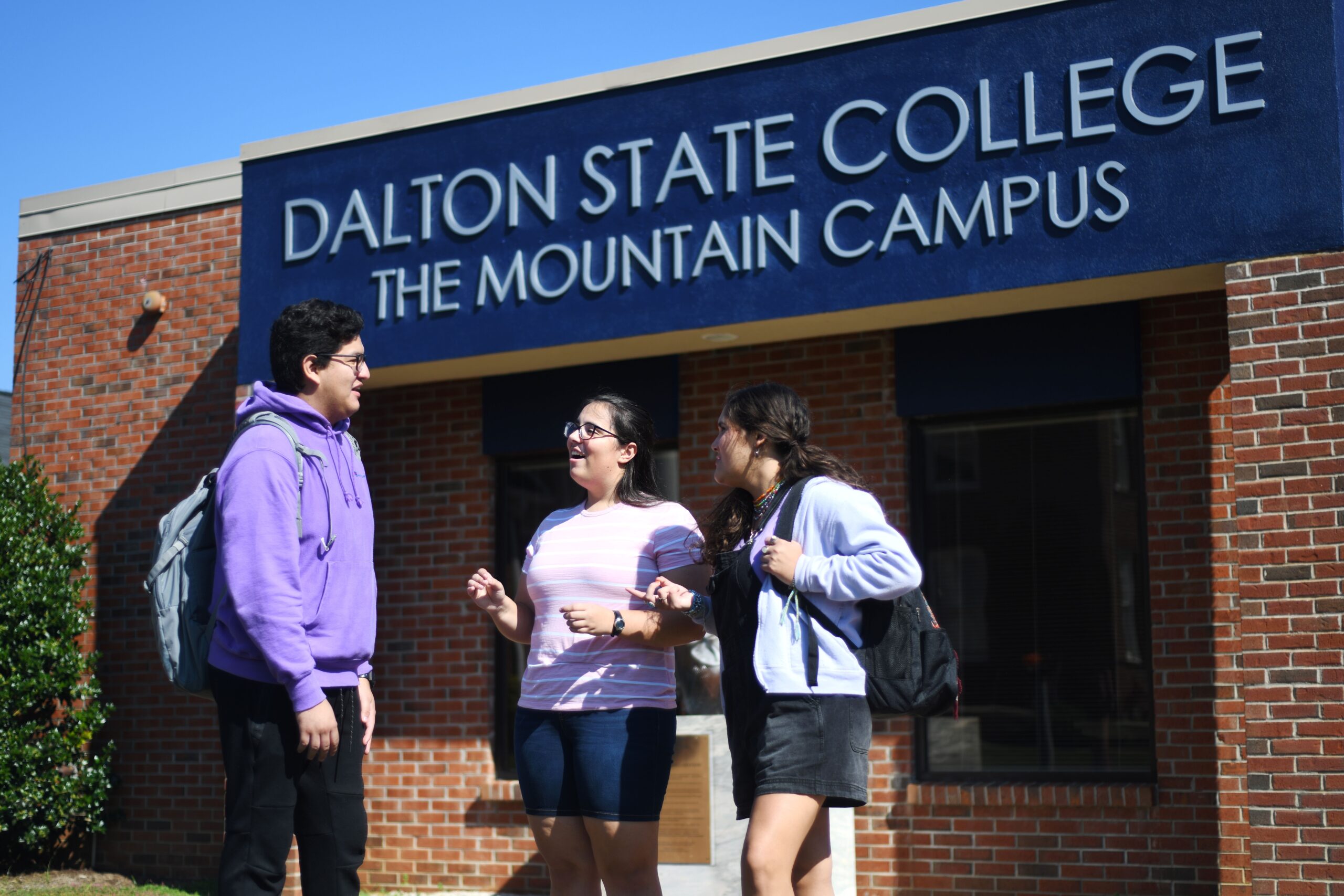 Mountain Campus exterior building with students talking
