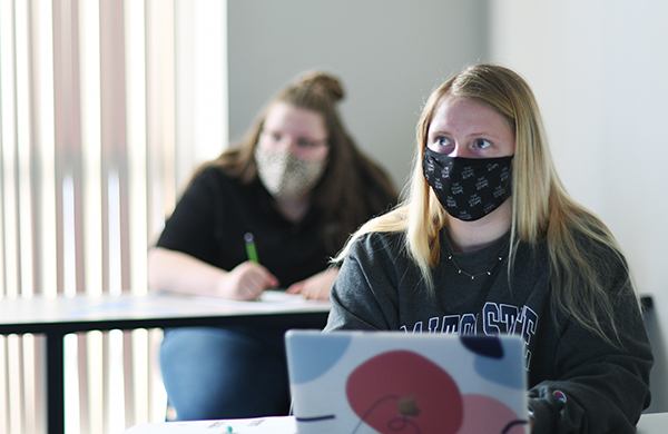 students, masked, in classroom
