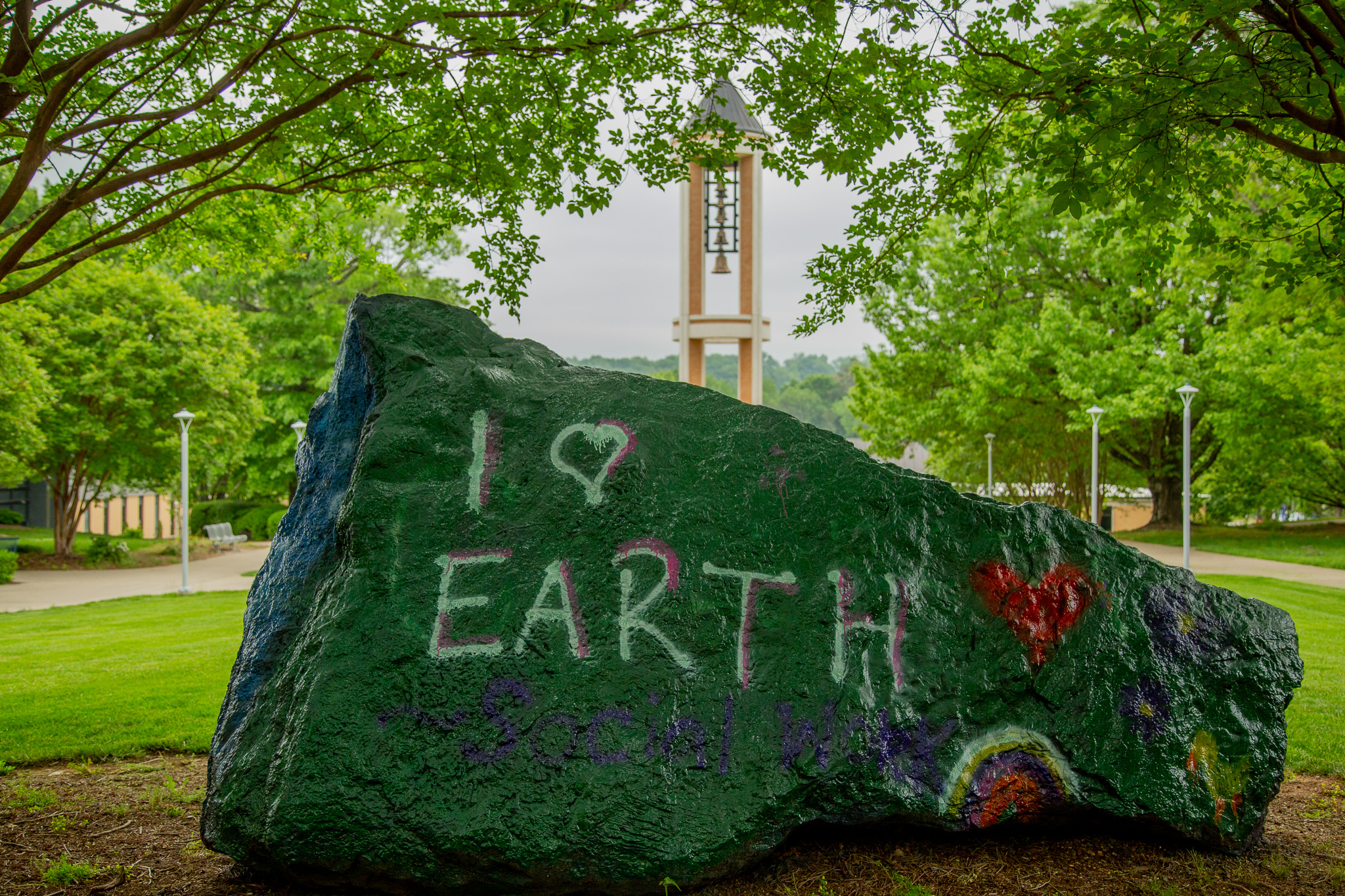 Photo of the Dalton State College boulder in front of the Dalton State Bell Tower