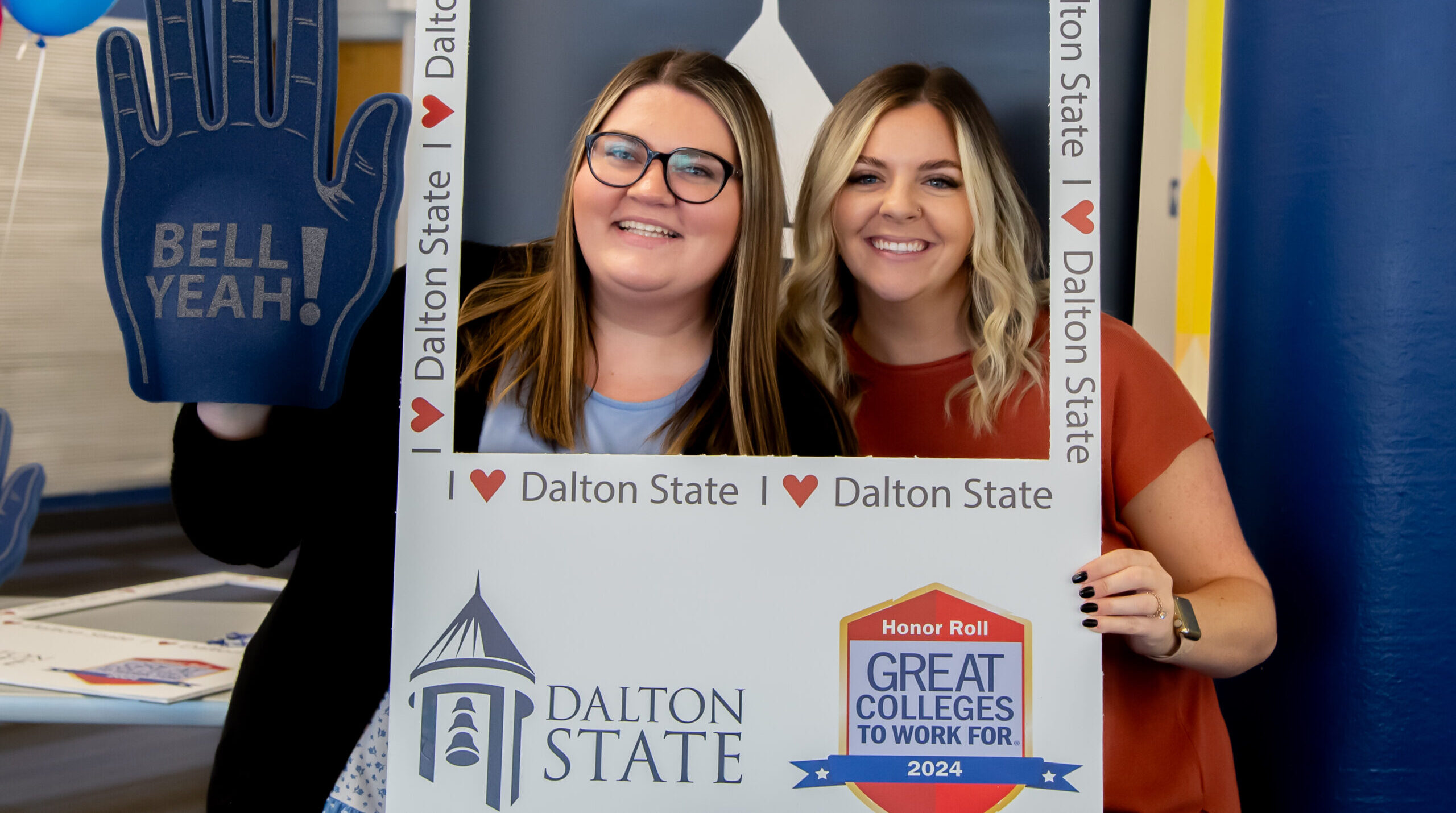 Dalton State staff members Chasity Burgess, left, and Chelsea Lopez, right, pose for a photo during an employee luncheon celebrating the college’s 2024 Great Colleges to Work For recognition.