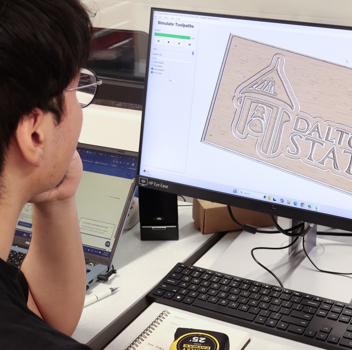 A student looking at an image on a computer screen.