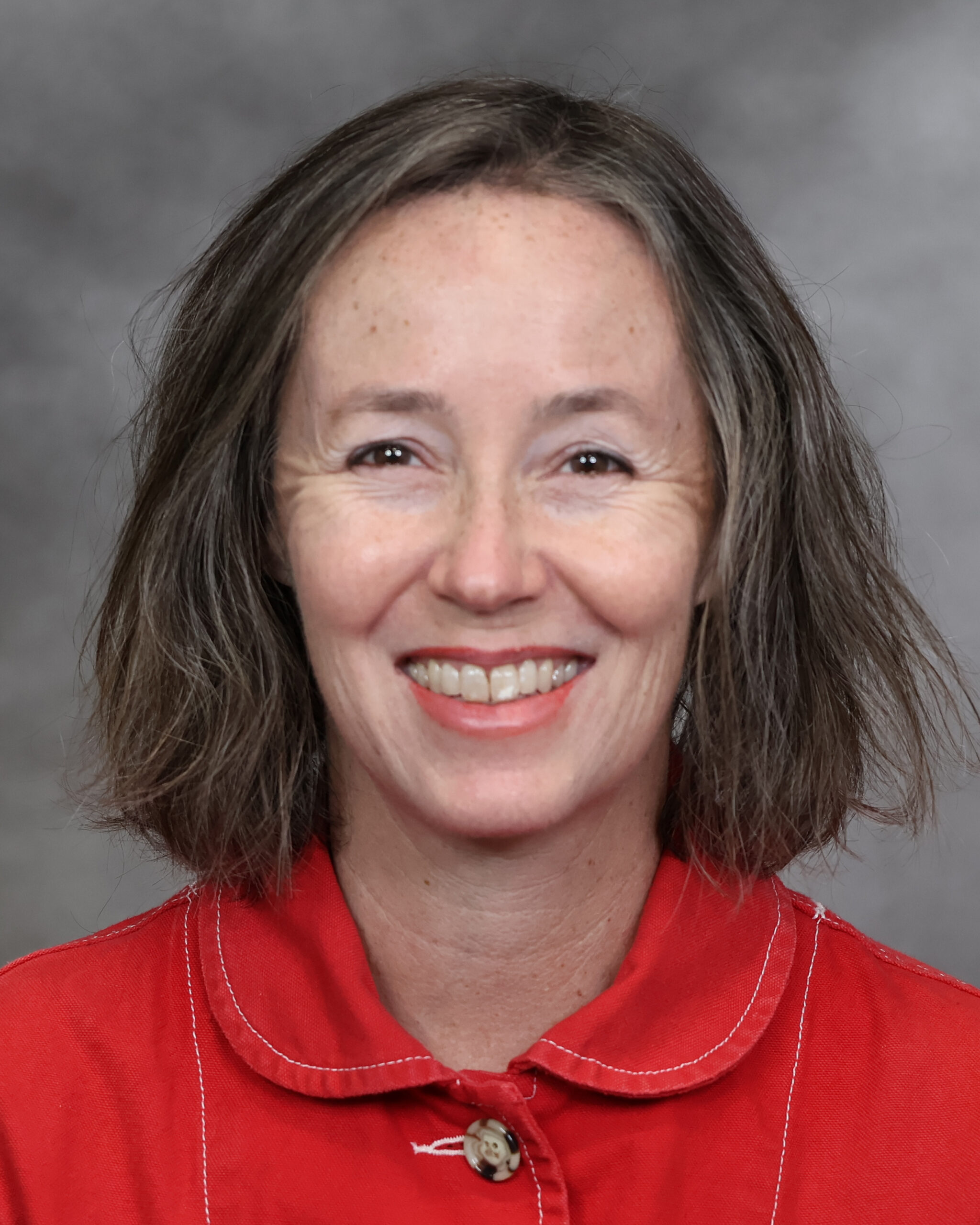 Professional headshot photo of a woman from the shoulder up.